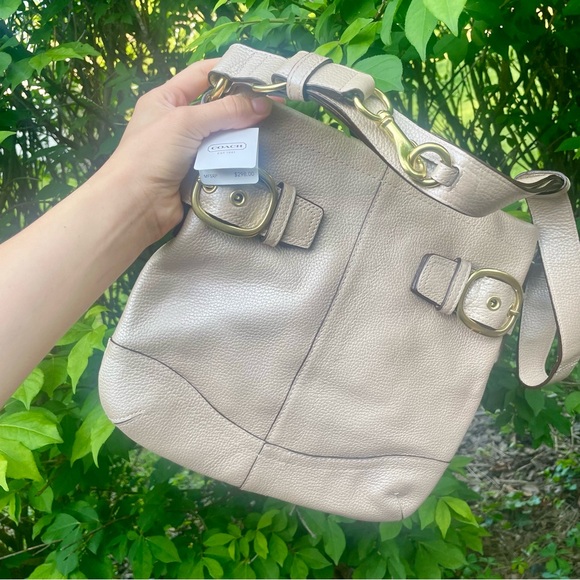Coach Handbags - Coach Leather Buckle Duffle in Pearl